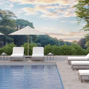 PURITY SITE PICTURE Purity Lounger pool area exterior with umbrella and greenery